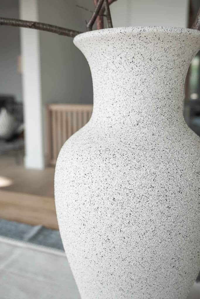 Signed Samantha's DIY stone vase is pictured, up close so you can see the texture of the light stone look she achieved.