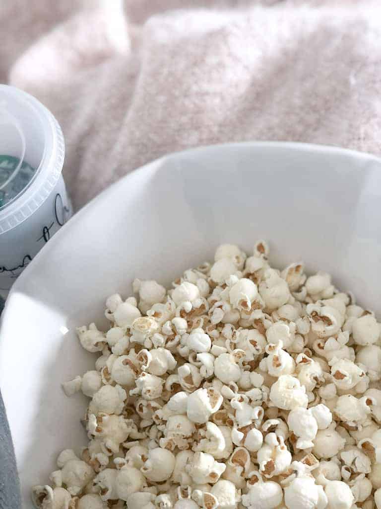 Signed Samantha's best shows to watch on Netflix Now - Bowl of popcorn shown.