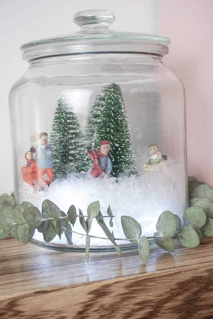 D.I.Y Christmas Terrariums with eucalyptus wrapped around it