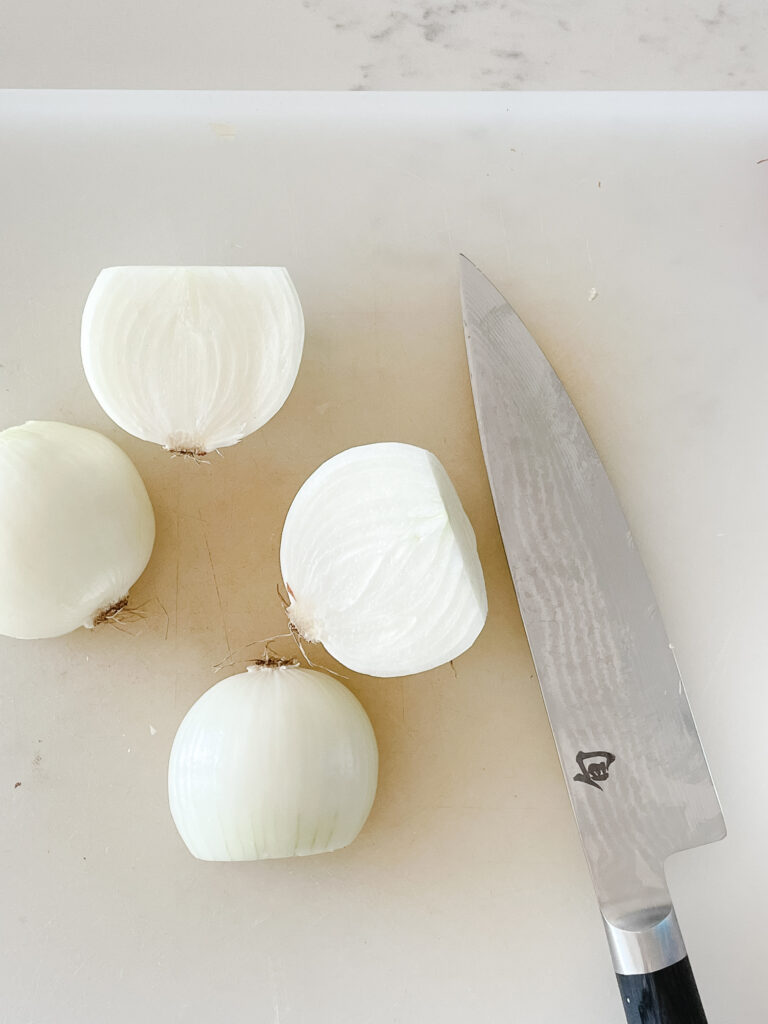 how to cut an onion - starting with halving the onions.