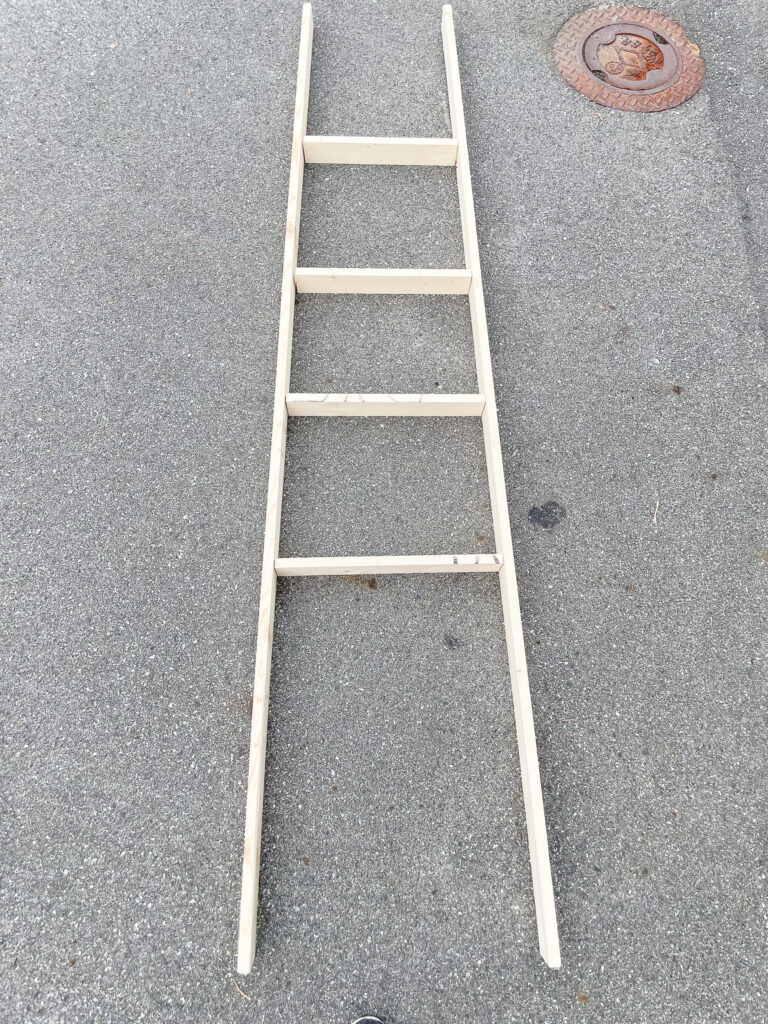 DIY Blanket Ladder in the making - unpainted on the ground.