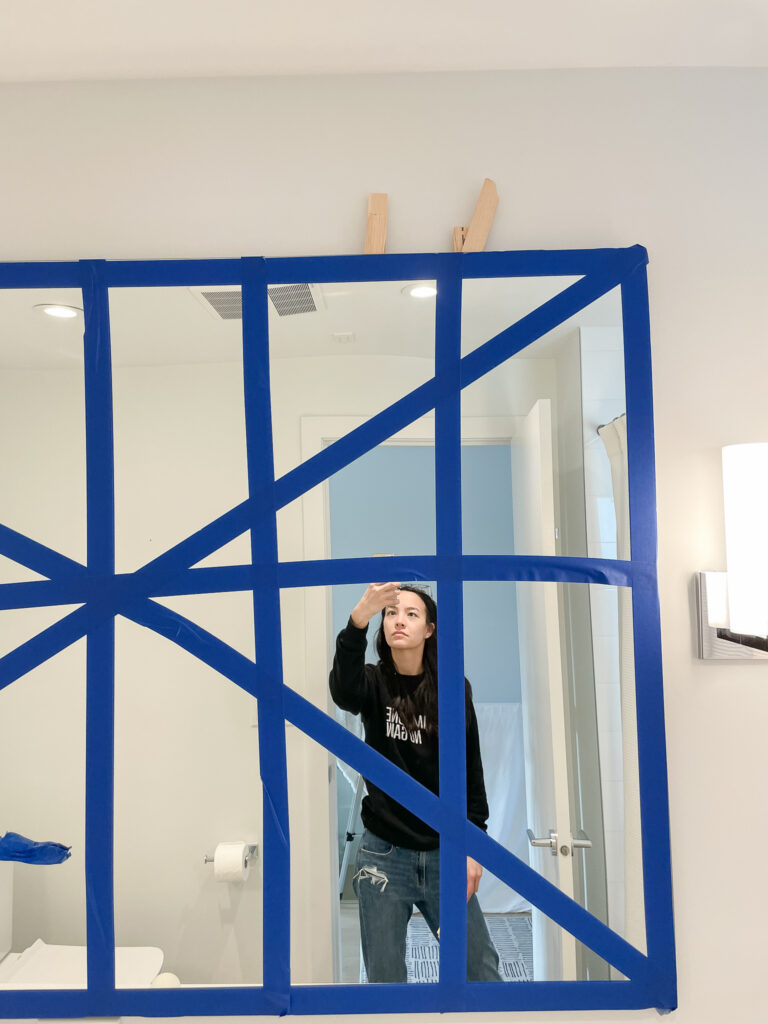 how to remove a builder grade mirror includes inserting shims behind the mirror between the mirror and the wall.