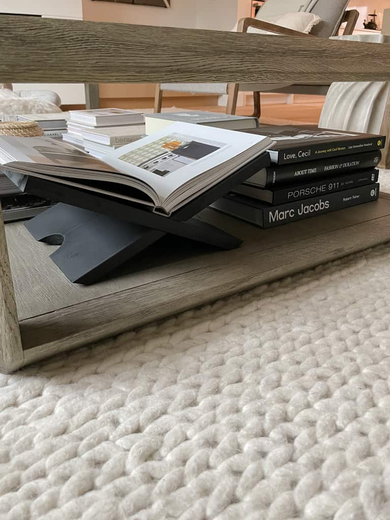 book display styled under a coffee table