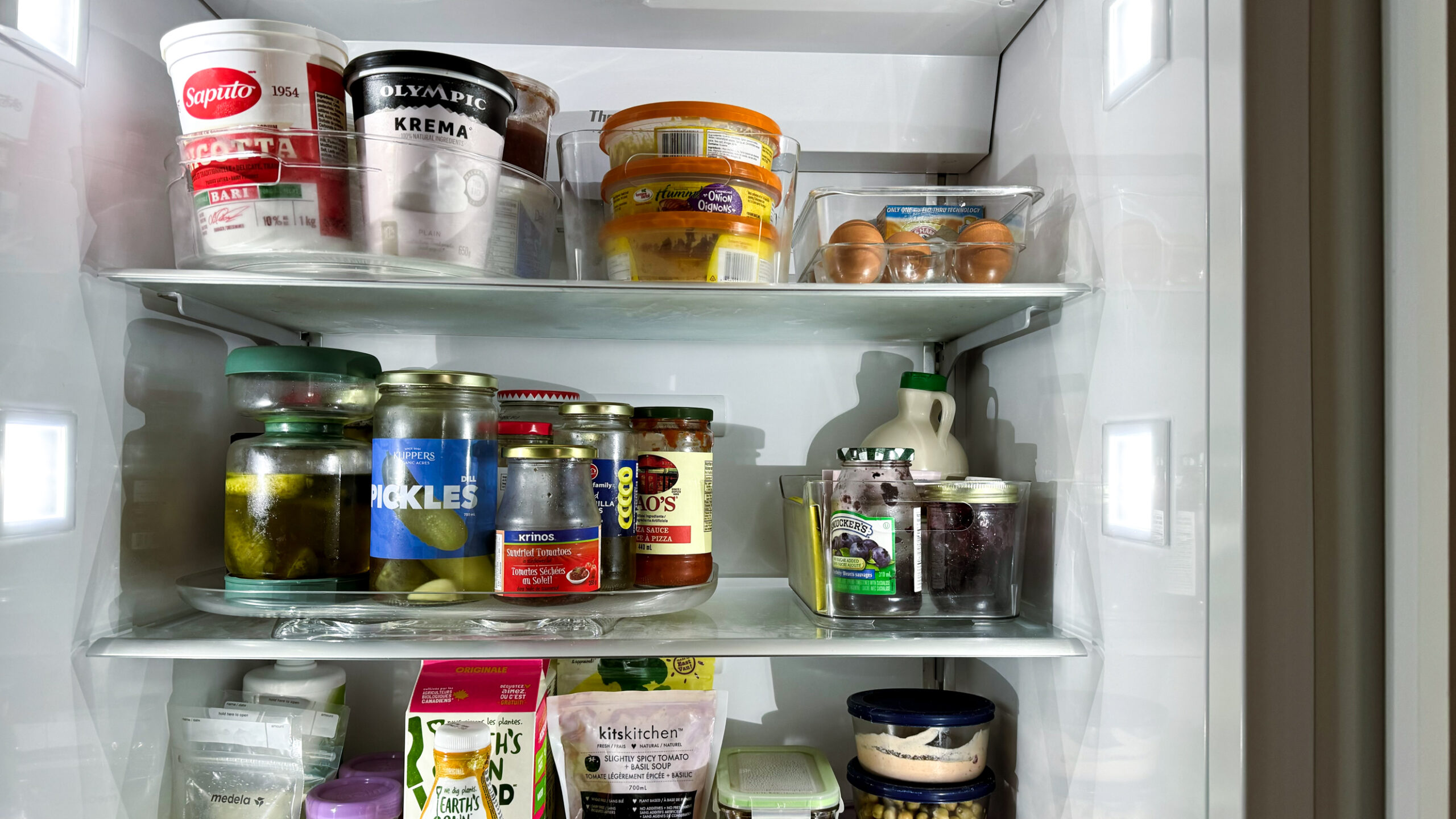 organizing your fridge using a turntable and plastic containers