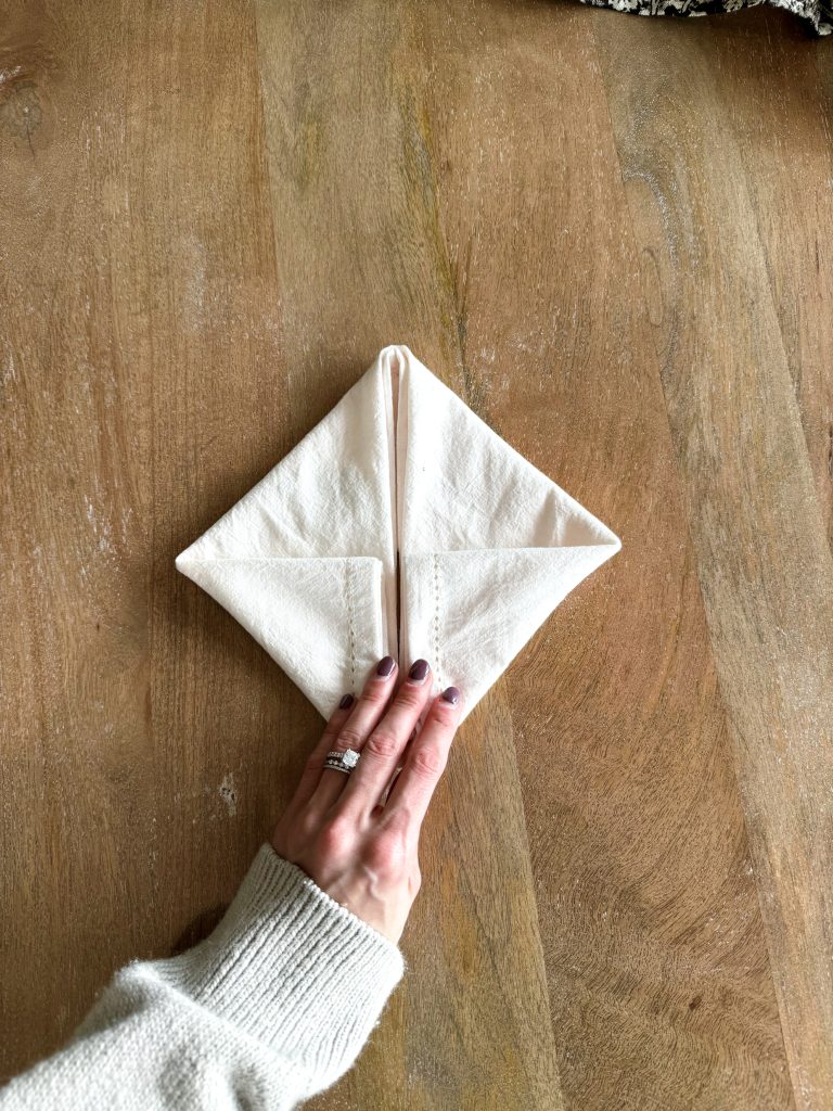 folding a napkin into a bunny