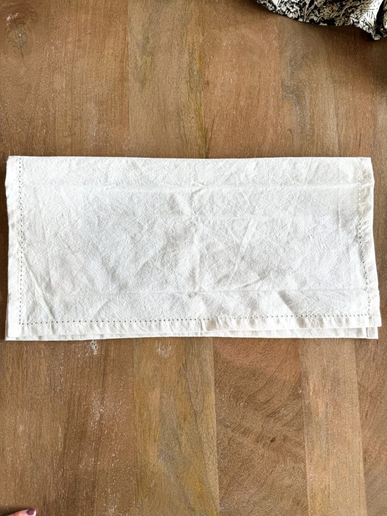 napkin fold step one - in half