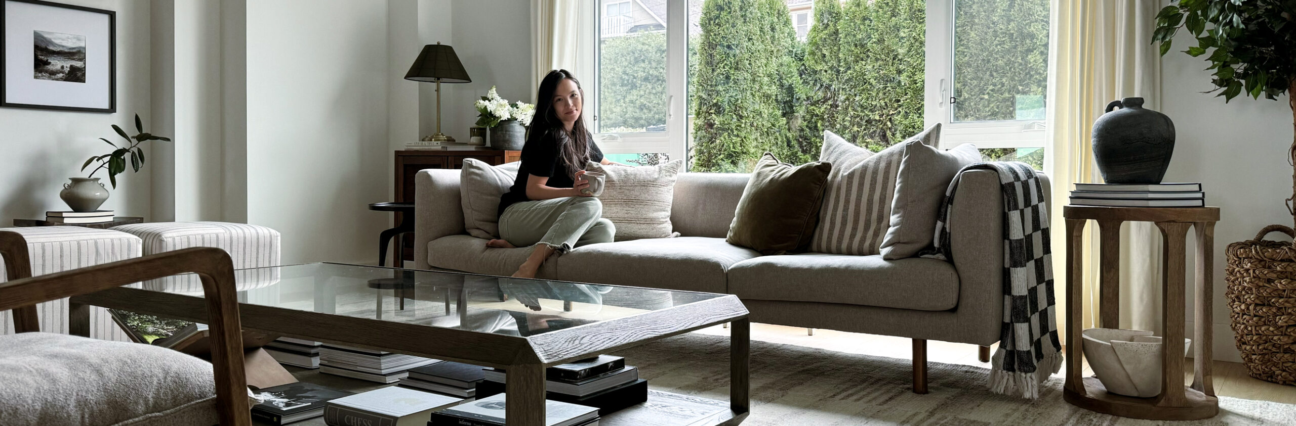 Decor refresh woman sitting on sofa with beautiful home decor around