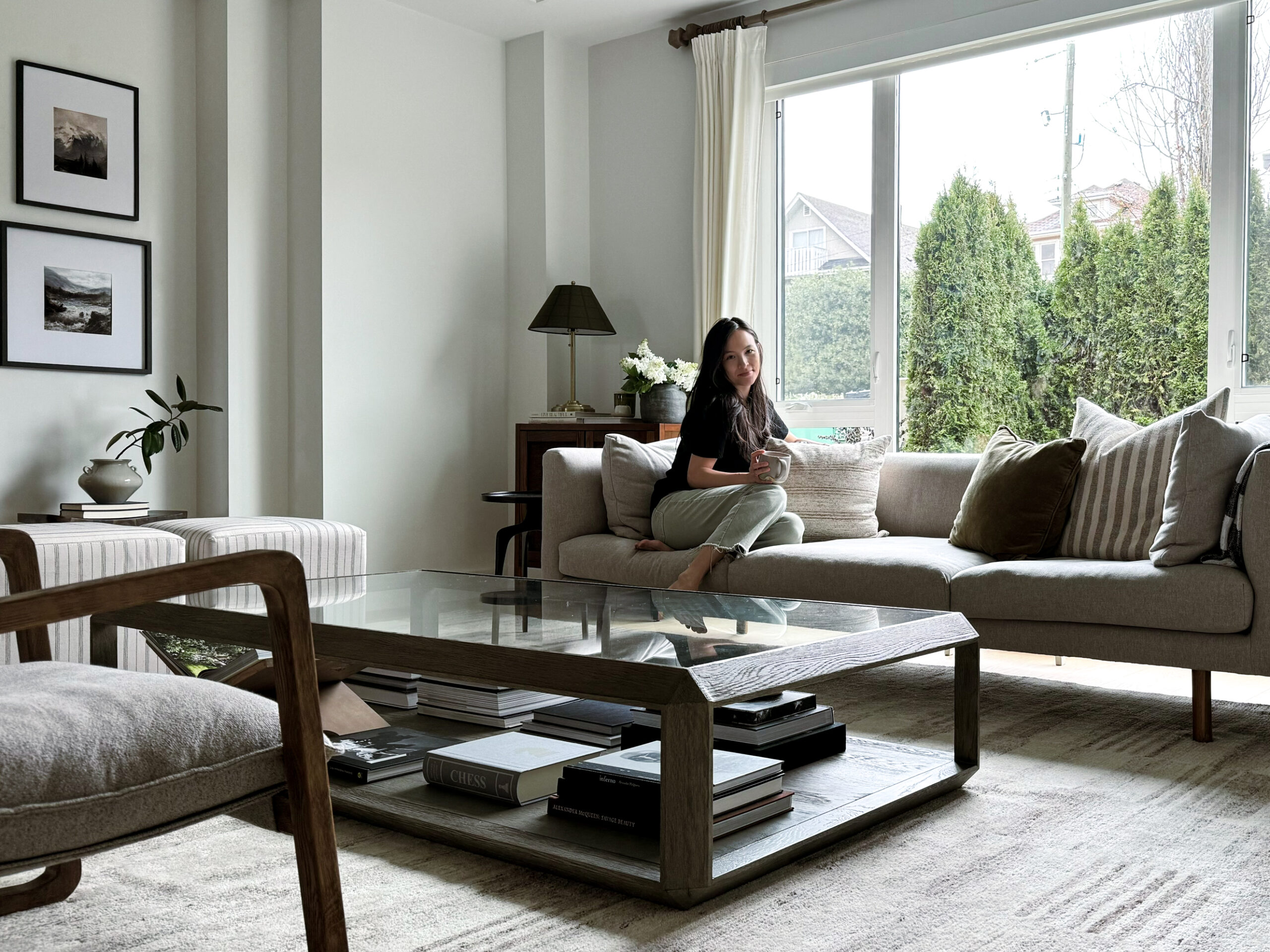 Decor refresh woman sitting on sofa with beautiful home decor around